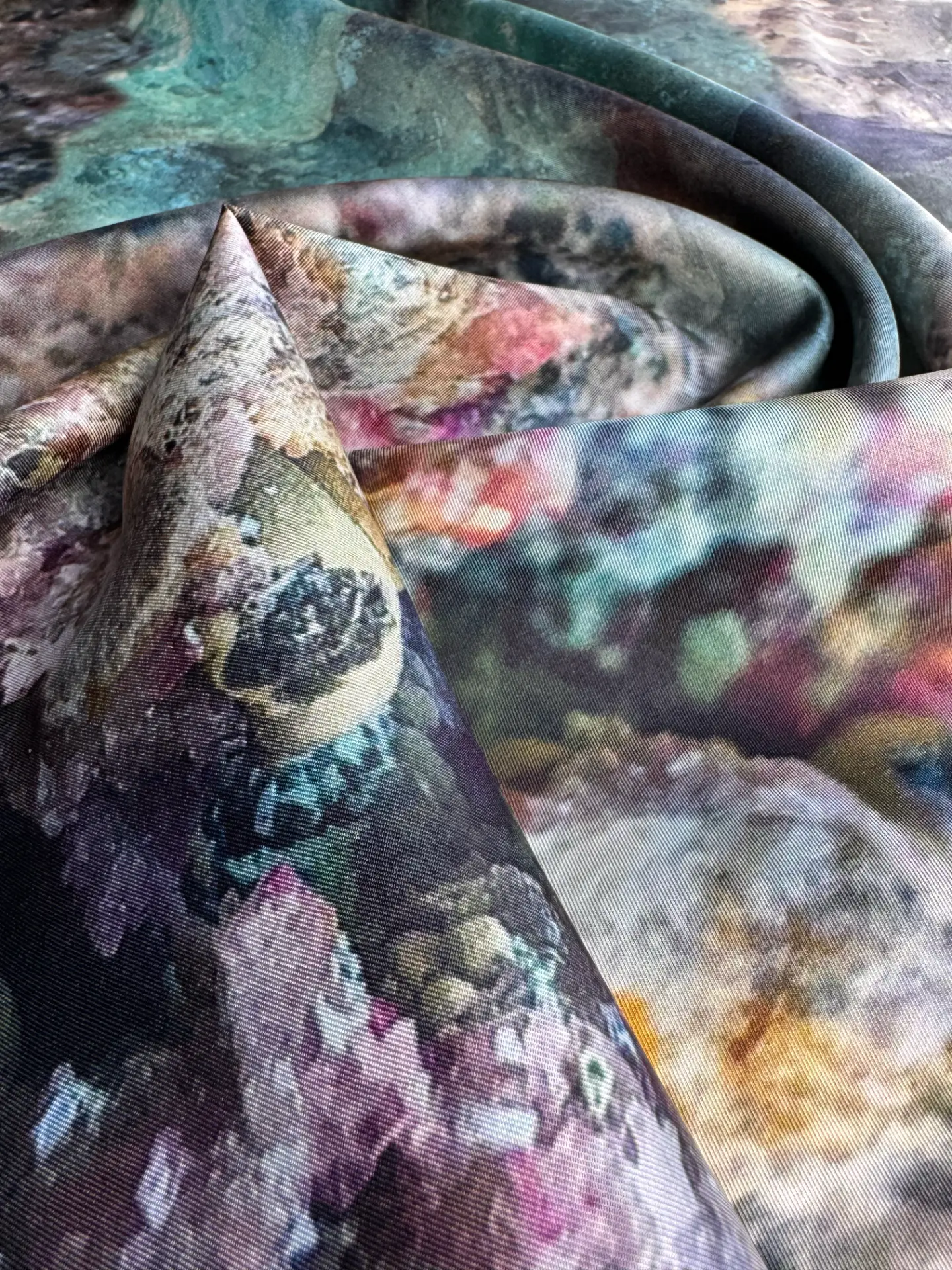 Macro detail of a hem finish on printed silk
