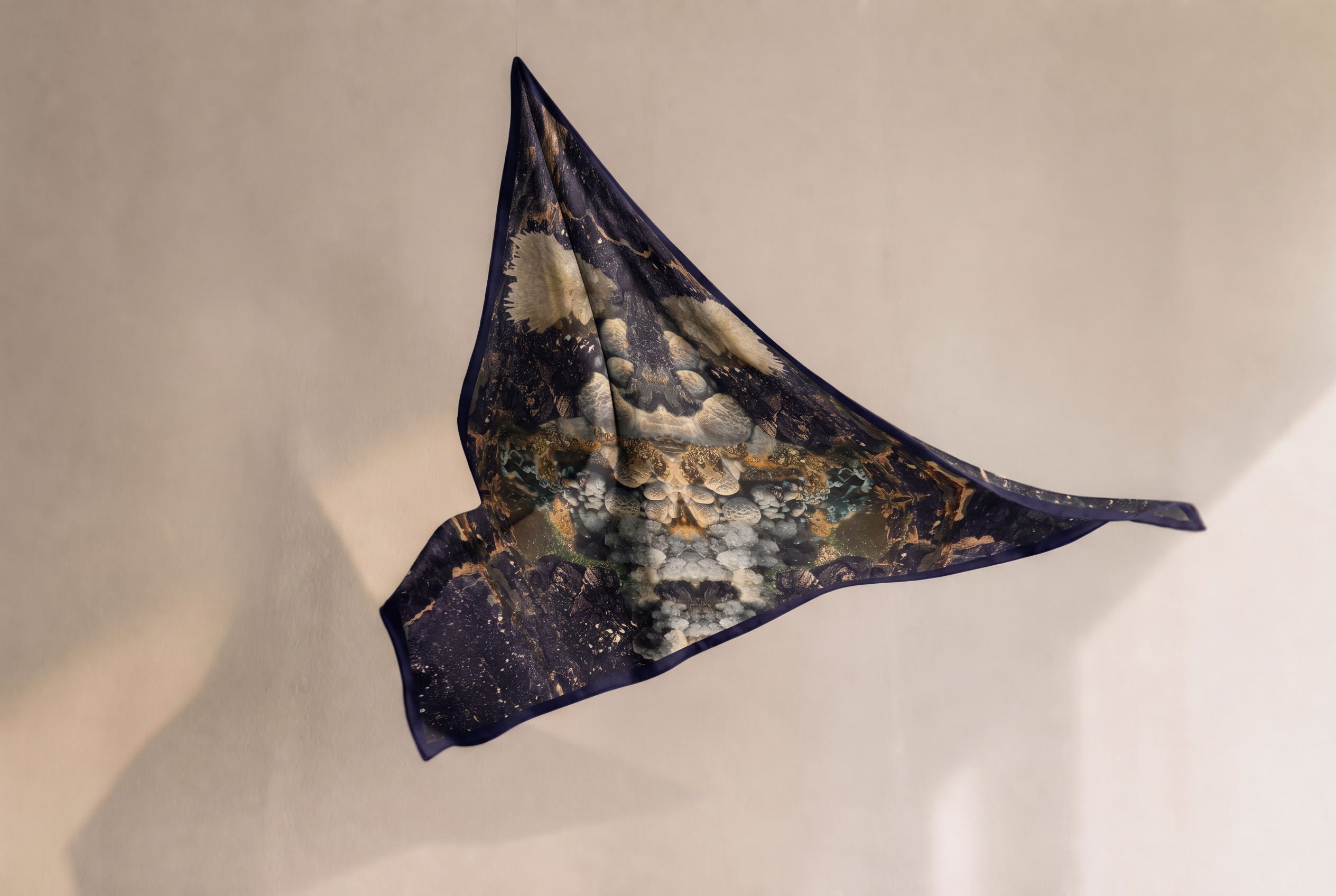 Silk square from the Portraits Minéraux collection suspended in an exhibition space